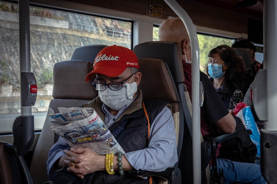 Elderly Man with surgical mask on bus